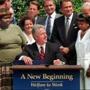 Then-President Bill Clinton in 1996 as he prepared to sign into law legislation that would overhaul America's welfare system.